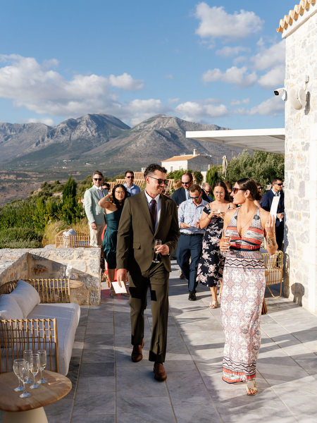 Wedding guests arriving at Aria Estate terrace with mountain views
