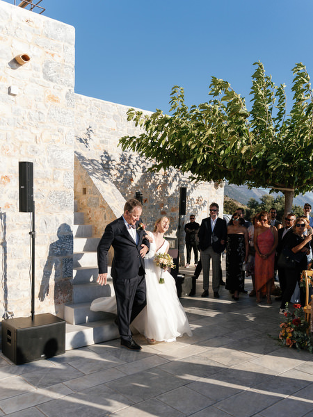 Bride walking down the aisle at Aria Estate outdoor ceremony