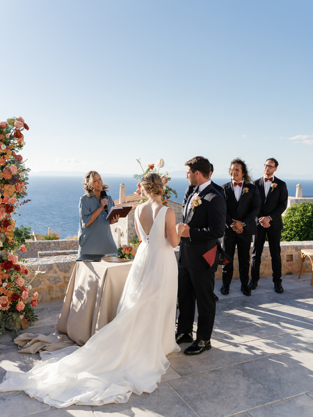 Bride and groom exchanging vows at Aria Estate wedding ceremony in Greece