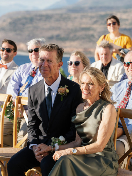 Parents watching vows at Aria Estate outdoor wedding