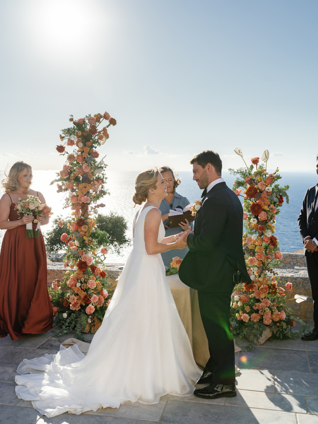 Bride and groom exchanging vows at Aria Estate sea view ceremony in Greece
