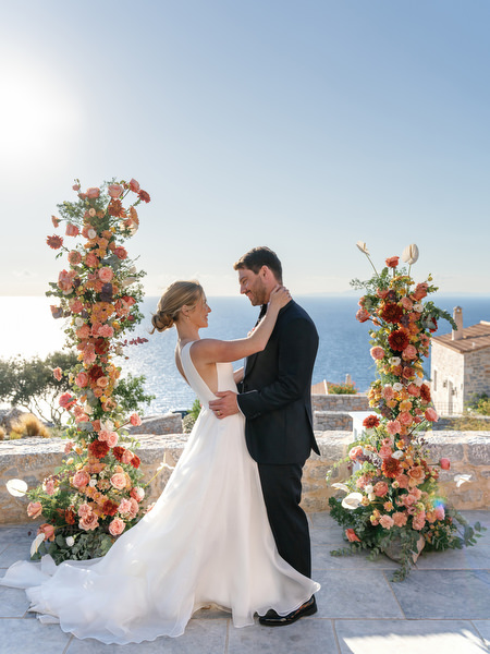 Bride and groom portrait at Aria Estate floral ceremony arch