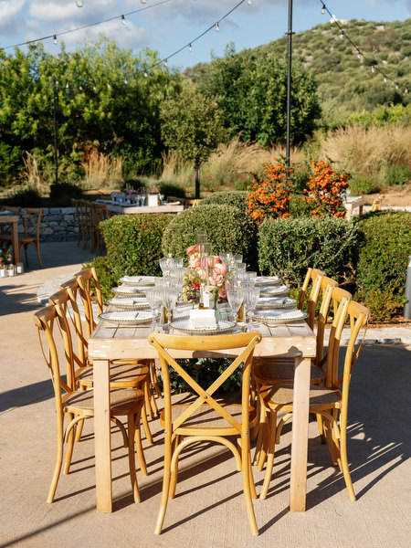 Outdoor reception at Aria Estate with string lights and vineyard backdrop