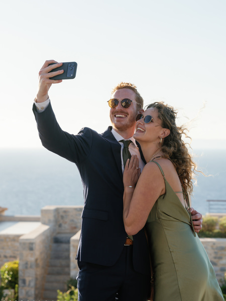 Guests taking selfie at Aria Estate destination wedding in Greece
