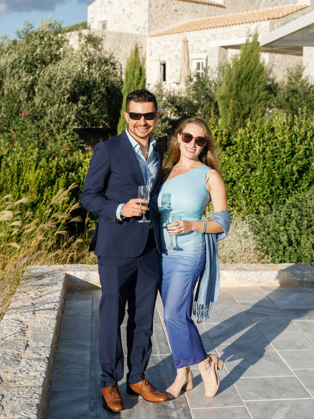 Wedding guests enjoying cocktail hour at Aria Estate Greece
