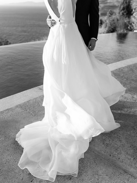 Bride portrait by infinity pool at Aria Estate wedding venue