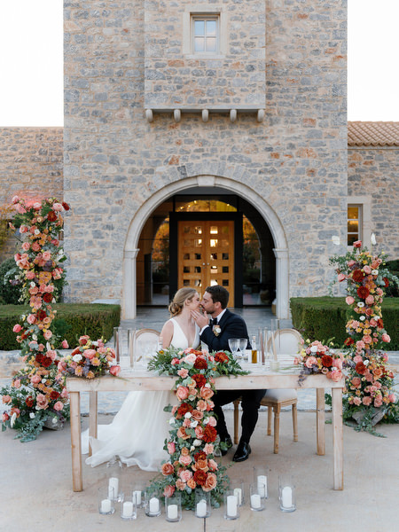 Romantic portrait at floral sweetheart table at Aria Estate
