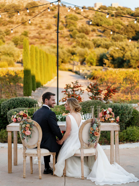 Bride and groom at sunset reception at Aria Estate
