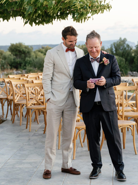 Groom and guest at Aria Estate wedding reception in Greece