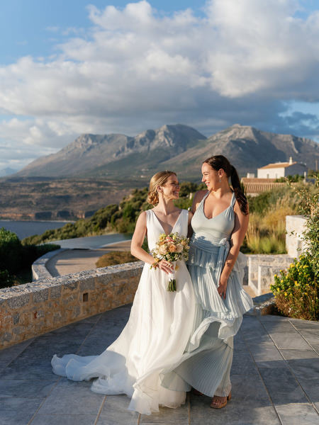 Bride and bridesmaid portrait at Aria Estate in Greece