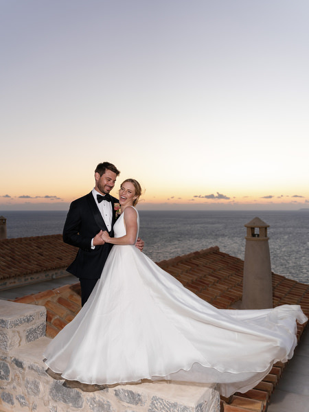 Bride twirling at sunset at Aria Estate wedding in Greece