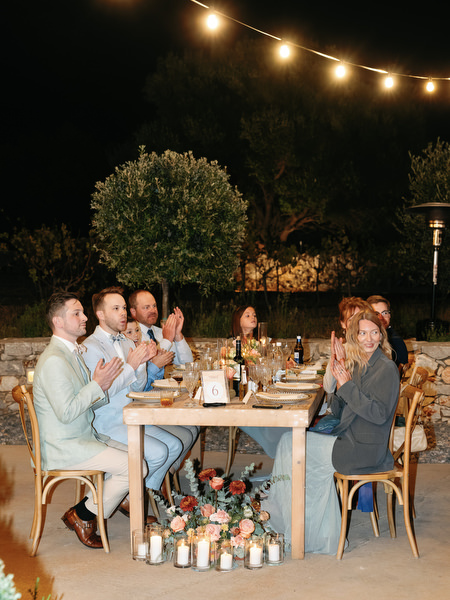 Wedding guests applauding at Aria Estate evening reception