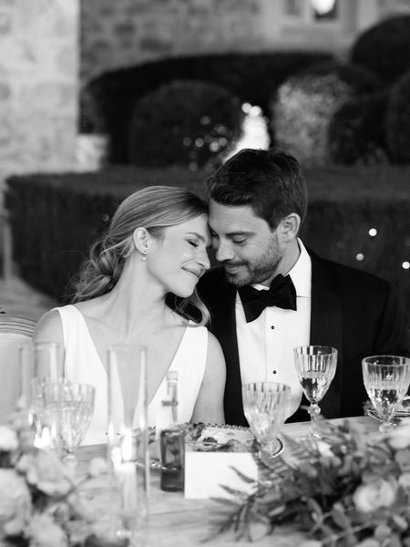 Bride and groom listening to speech at Aria Estate night reception
