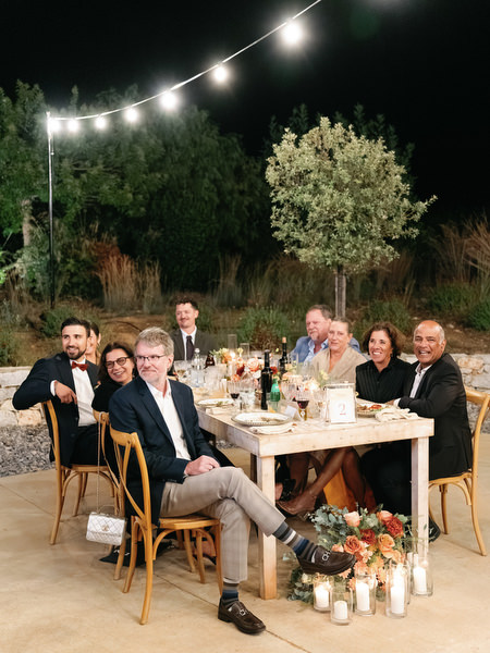 Outdoor wedding dinner at Aria Estate under fairy lights