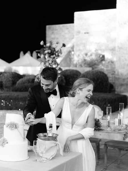 Bride and groom cutting cake at Aria Estate Greece
