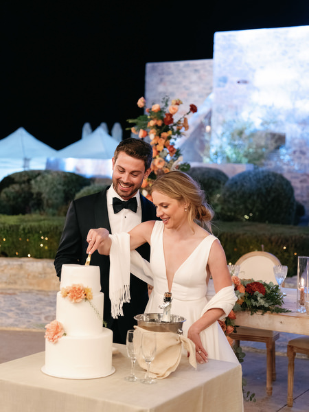 Night cake cutting at Aria Estate wedding in Greece