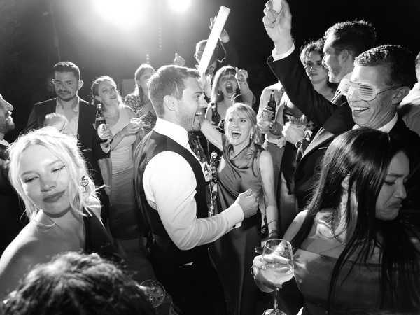 Groom celebrating at Aria Estate wedding party