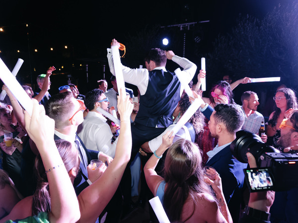 Groom celebrating at Aria Estate wedding party