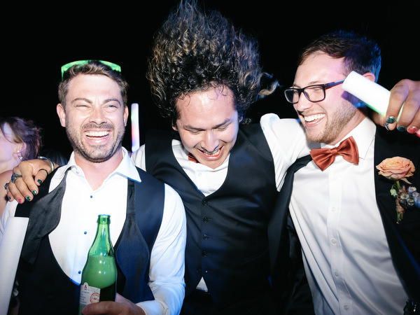 Groomsmen and groom dancing at Aria Estate destination wedding