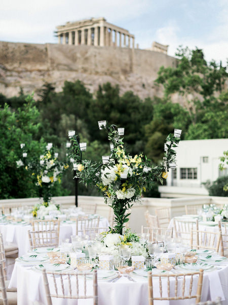 Elegant outdoor dinner setup for pre-wedding dinner under the Acropolis