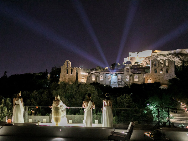 Night view of Athens with Acropolis lights during pre-wedding dinner
