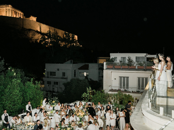 Dinner celebration under the Acropolis at night