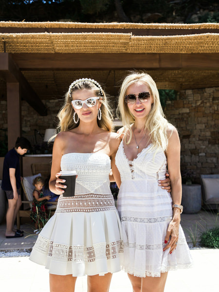 Female guests in white dresses during Athens destination wedding brunch