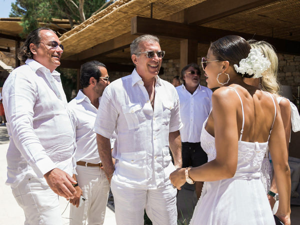 Friends greeting each other at Four Seasons Astir Palace brunch celebration