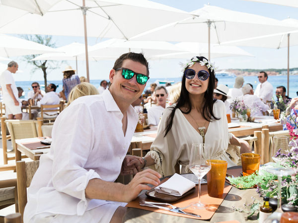 Couple enjoying drinks and conversation at Four Seasons Astir Palace