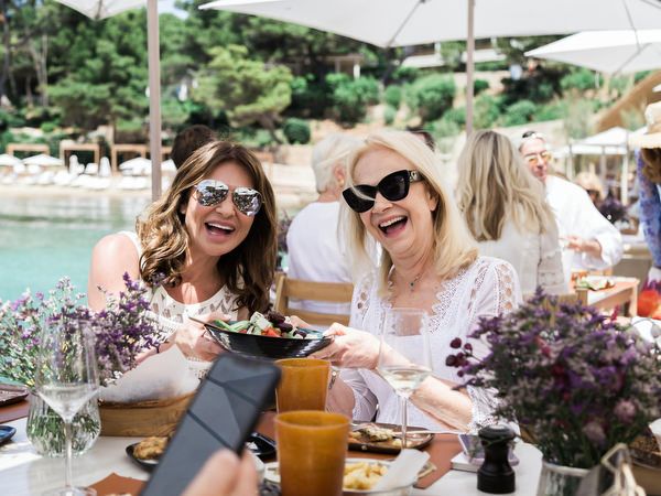 Guests posing together during destination wedding brunch in Athens