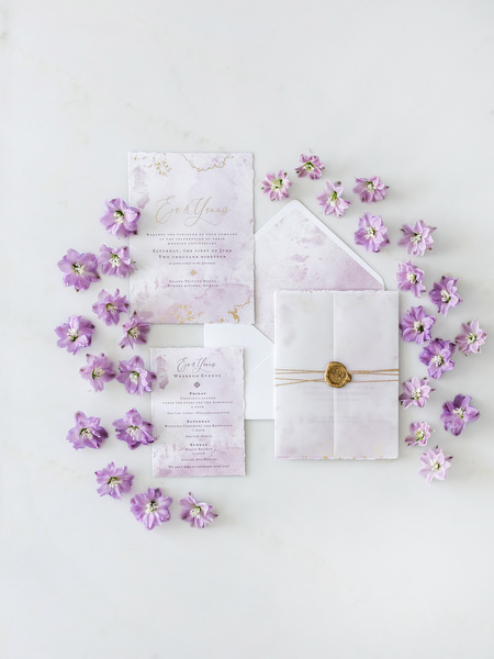 Lilac and blush wedding invitation suite styled for a couture Athens wedding at Four Seasons Astir Palace