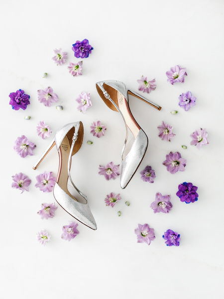 Silver bridal heels arranged with lilac flowers for a couture Athens wedding at Four Seasons Astir Palace, Greece