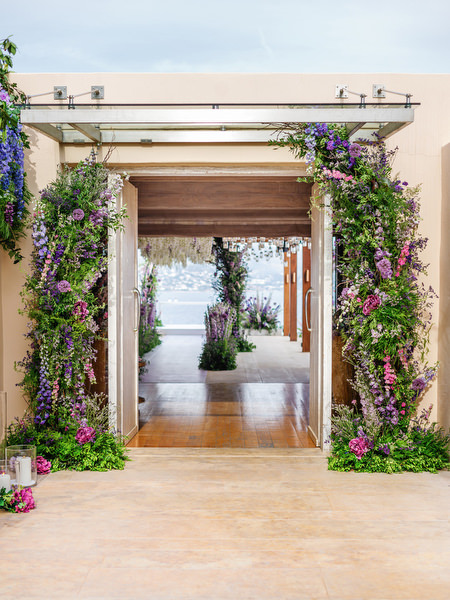Floral-covered entrance walkway at Island Resort Athens Riviera, decorated in lilac tones for a luxury Athens wedding