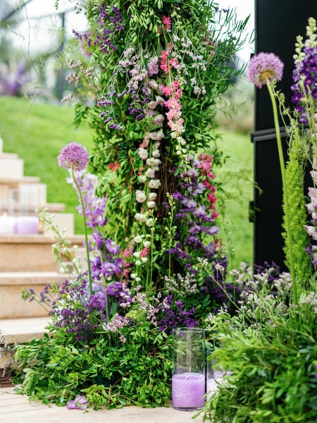 Lavish purple and green floral aisle installation at a couture Athens wedding at Island Resort Athens Riviera