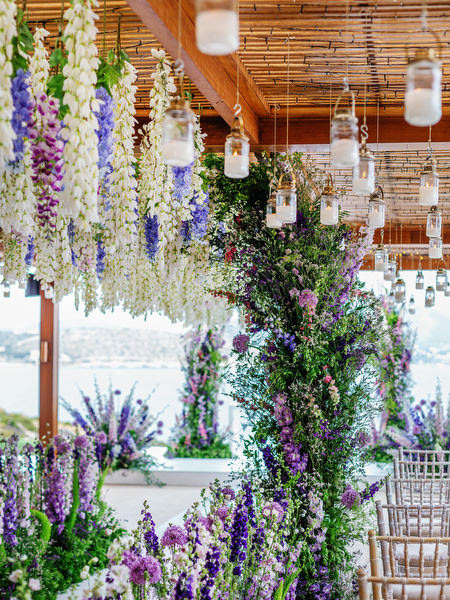 Floral column detail in purple and blush tones at a high-end Athens wedding at Island Resort Athens Riviera, Greece