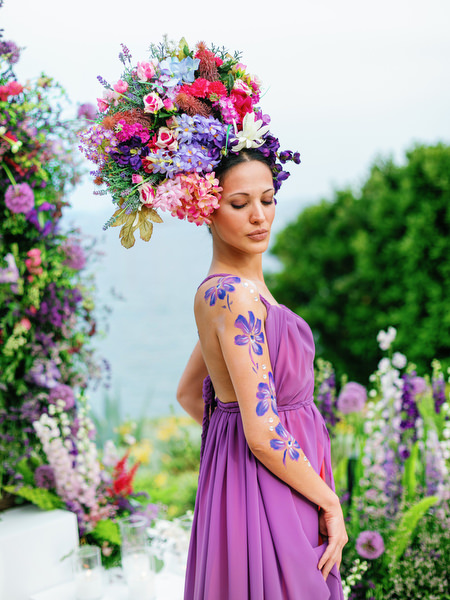 Guest wearing statement floral headpiece at a couture Athens wedding at Island Resort Athens Riviera on the Athens Riviera