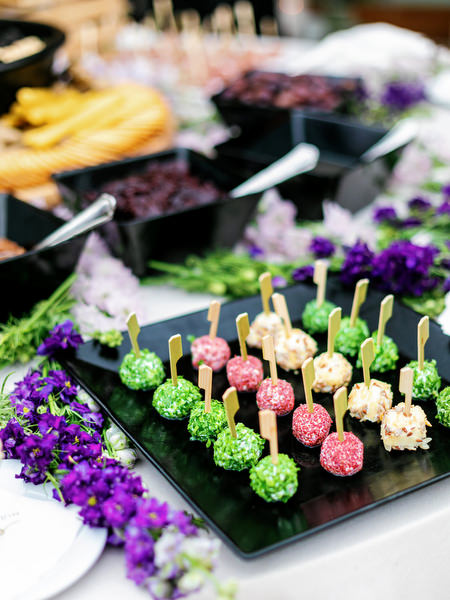 Luxury dessert station with purple florals and Mediterranean styling at an Island Resort Athens Riviera wedding on the Athens Riviera