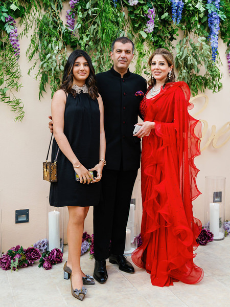 Guests in couture eveningwear posing during a luxury Athens wedding at Island Resort Athens Riviera on the Athens Riviera