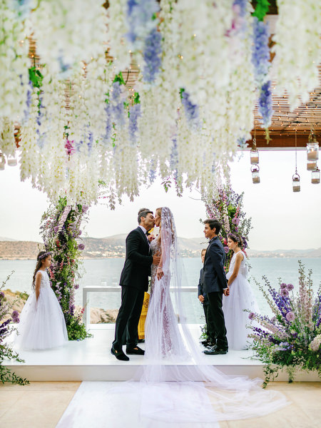 Emotional ceremony moment with sea views during a luxury Athens Riviera wedding at Island Resort Athens Riviera, Greece