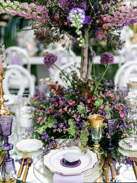 Lush floral arrangement in lilac tones decorating the Island Resort Athens Riviera wedding reception