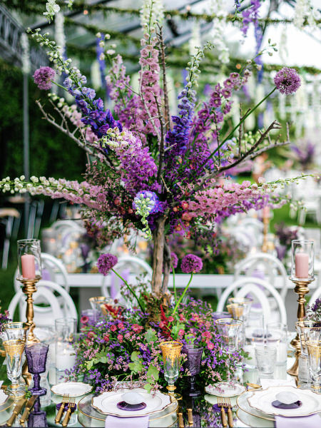 Lush floral arrangement in lilac tones decorating the Island Resort Athens Riviera wedding reception