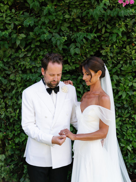 Bride and groom holding hands during intimate portrait session at Athenian Riviera wedding
