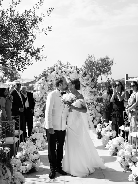 Guests applauding bride and groom during ceremony at Four Seasons Athens
