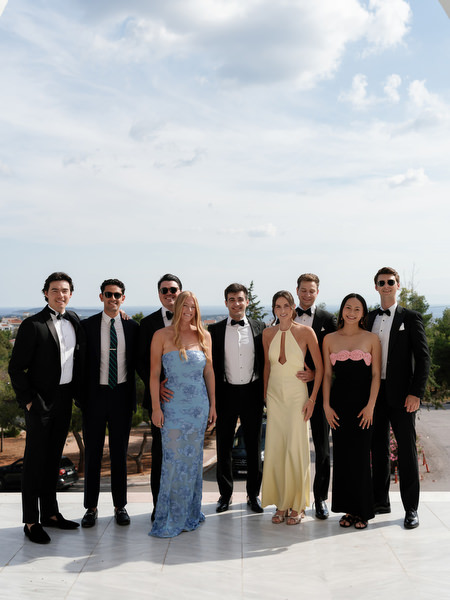 Wedding party gathered outside church before luxury Greek Orthodox ceremony in Athens