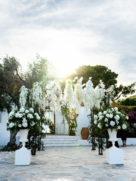White floral ceremony design glowing in golden hour light at Island Resort Athens Riviera – The Residence