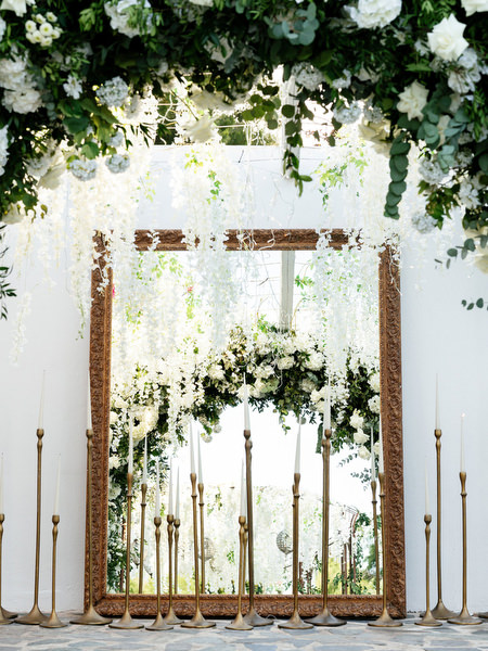 Dramatic floral-framed entrance with cascading white blooms at Island Resort Athens Riviera
