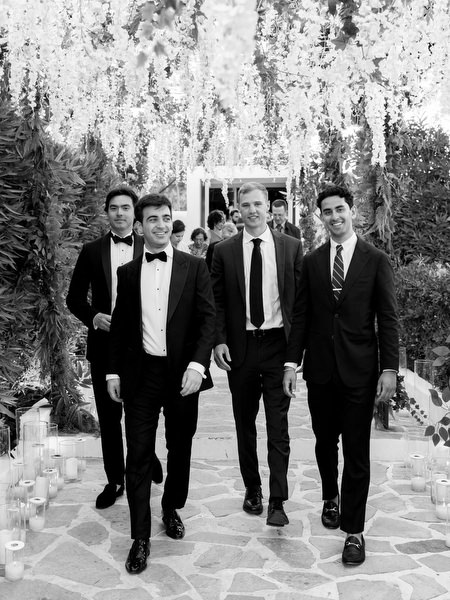 Guests walking beneath dramatic floral installation at Island Resort Athens Riviera