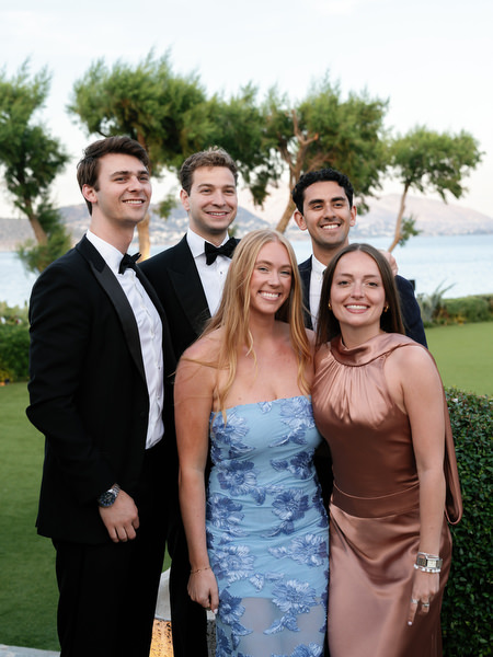 Friends posing together during Island Resort Athens Riviera destination wedding