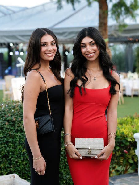 Two guests posing during golden hour cocktail hour at Island Resort Athens Riviera