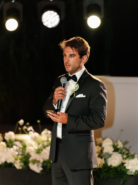 Bestman delivering heartfelt speech during Island Resort Athens Riviera wedding reception
